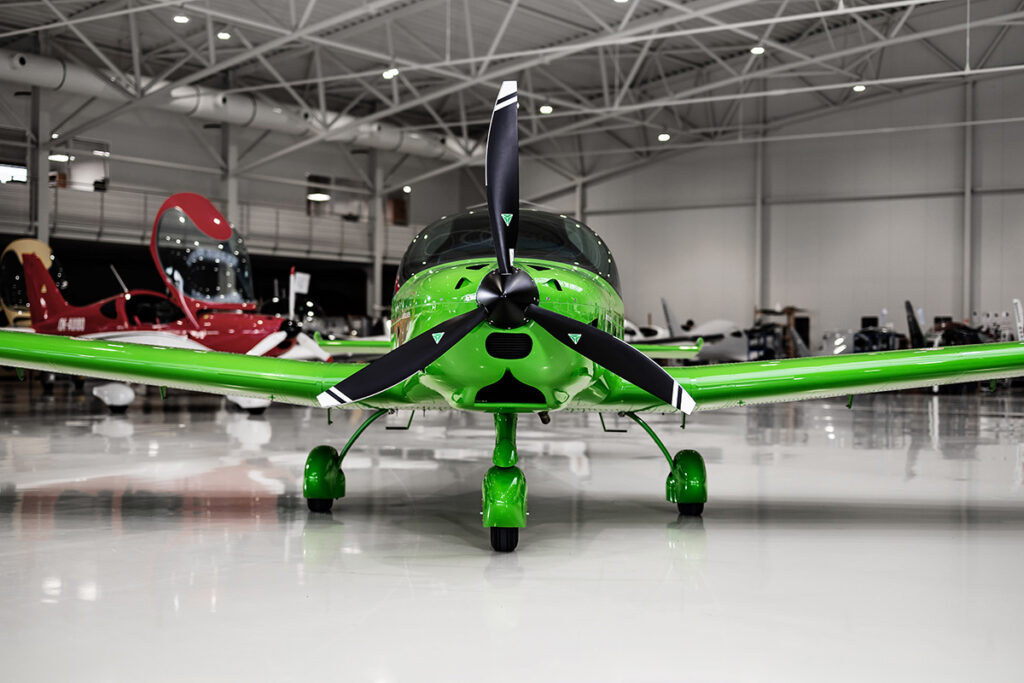 Bristell B23 green in hangar front view